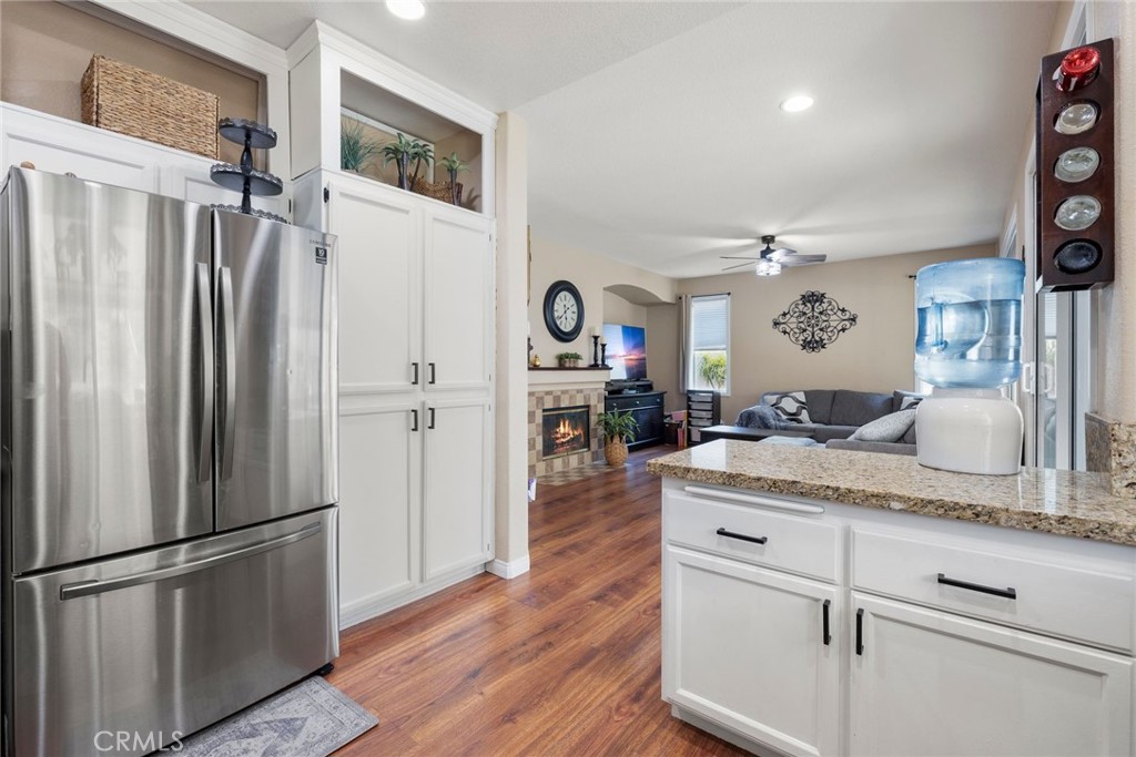17821 Morning Rock Circle Riverside, CA 92503 - Photo 19 of 47 a kitchen with stainless steel appliances granite countertop a refrigerator and a sink