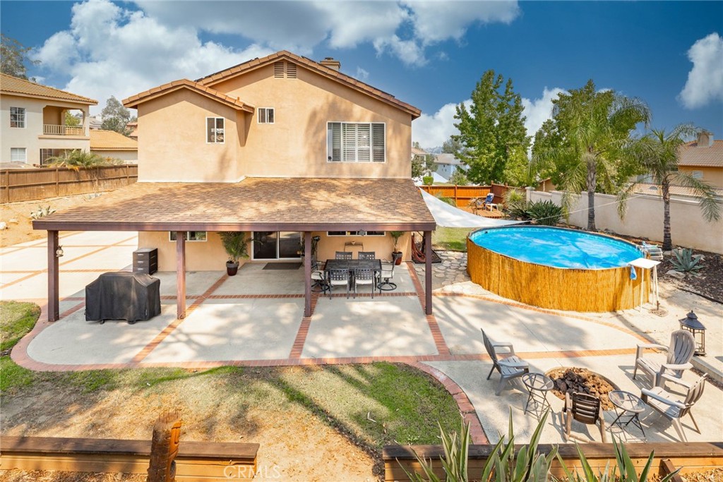 17821 Morning Rock Circle Riverside, CA 92503 - Photo 34 of 47 a view of a house with pool and chairs
