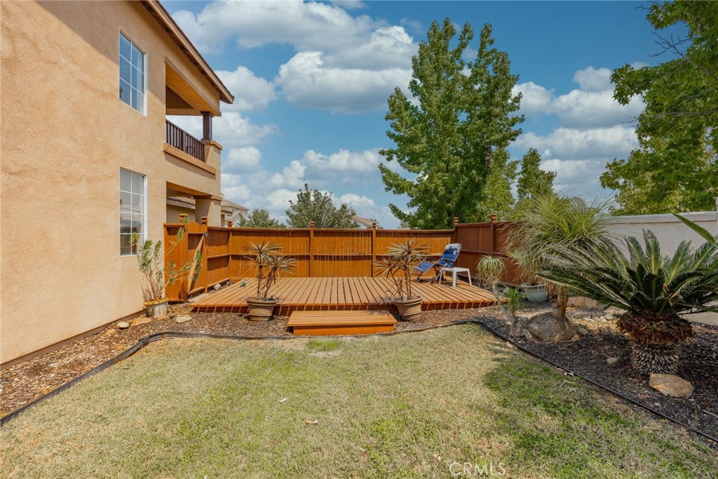 17821 Morning Rock Circle Riverside, CA 92503 - Photo 36 of 47 a view of a tennis court with a house in the background