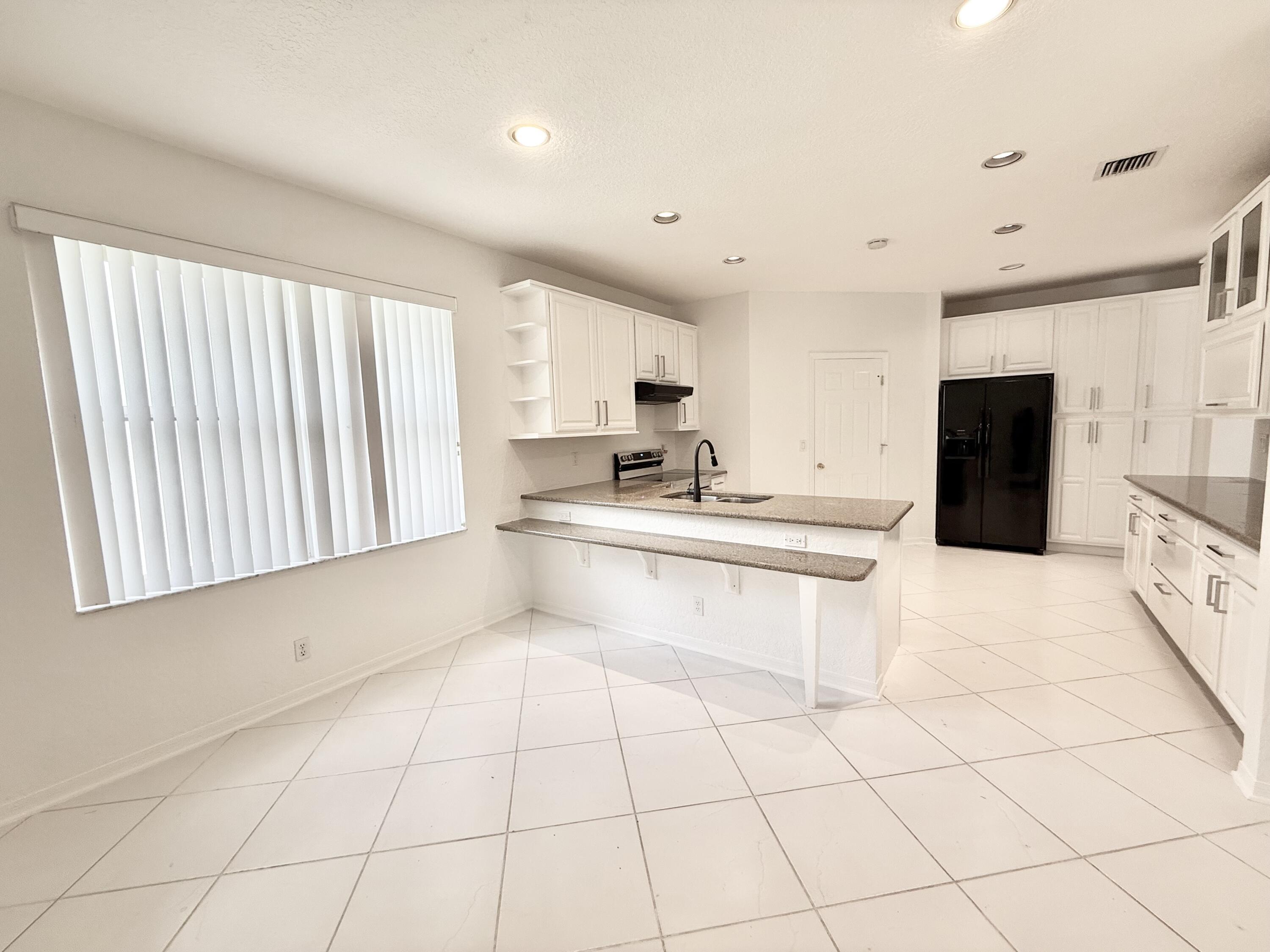 12310 Riverfalls Court Boca Raton, FL 33428 - Photo 10 of 30 Beautifully refinished cabinets