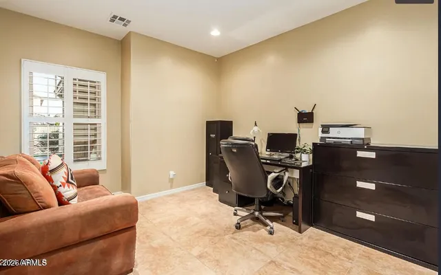 a workspace with furniture and a window