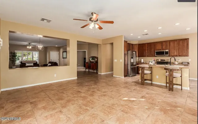a view of kitchen with refrigerator stove and microwave