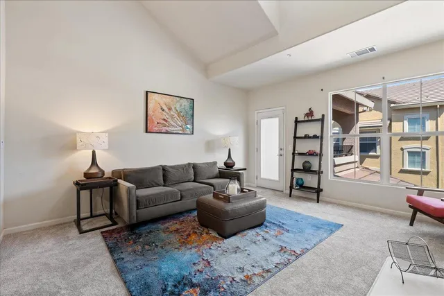 a living room with furniture and a rug