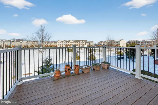 a view of a balcony with chairs