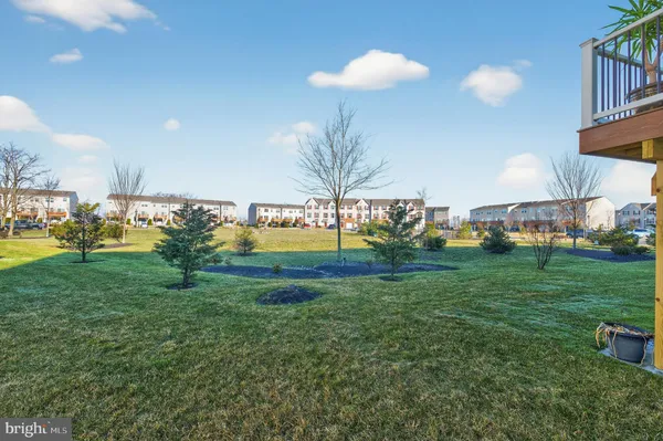 a view of a house with a backyard porch and sitting area