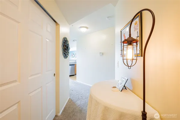 a bedroom with a bed and the view of bathroom
