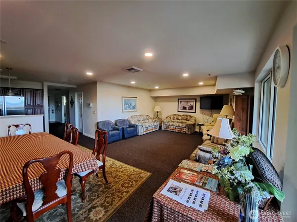 a kitchen with a table chairs stove and cabinets