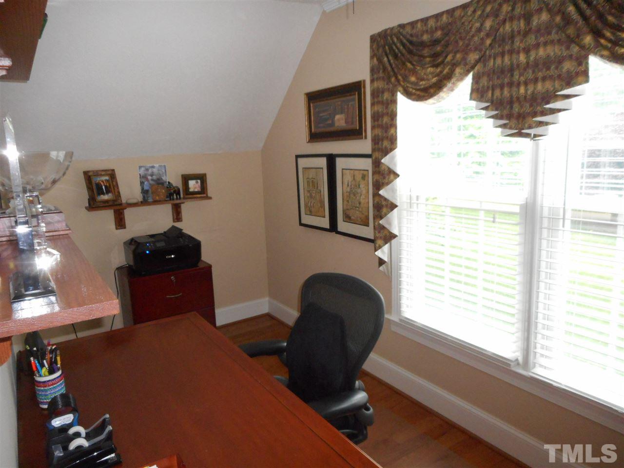 7920 Sutterton Court Raleigh, NC 27615 - Photo 12 of 22 a living room with furniture and a window