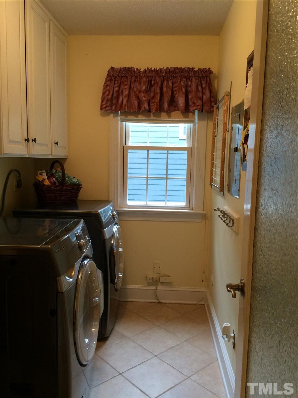 7920 Sutterton Court Raleigh, NC 27615 - Photo 13 of 22 a utility room with dryer and washer