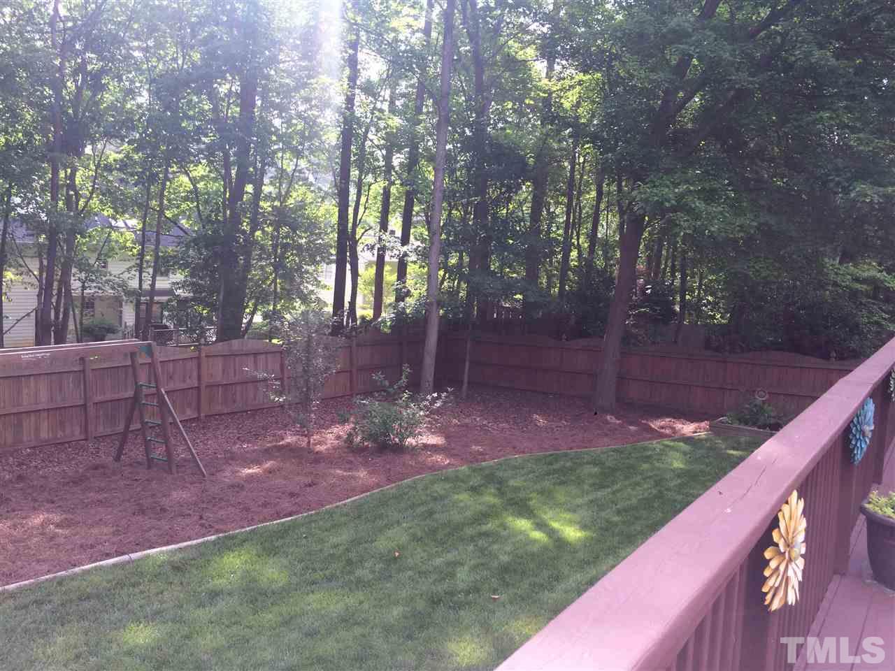 7920 Sutterton Court Raleigh, NC 27615 - Photo 14 of 22 a view of a backyard with tree s