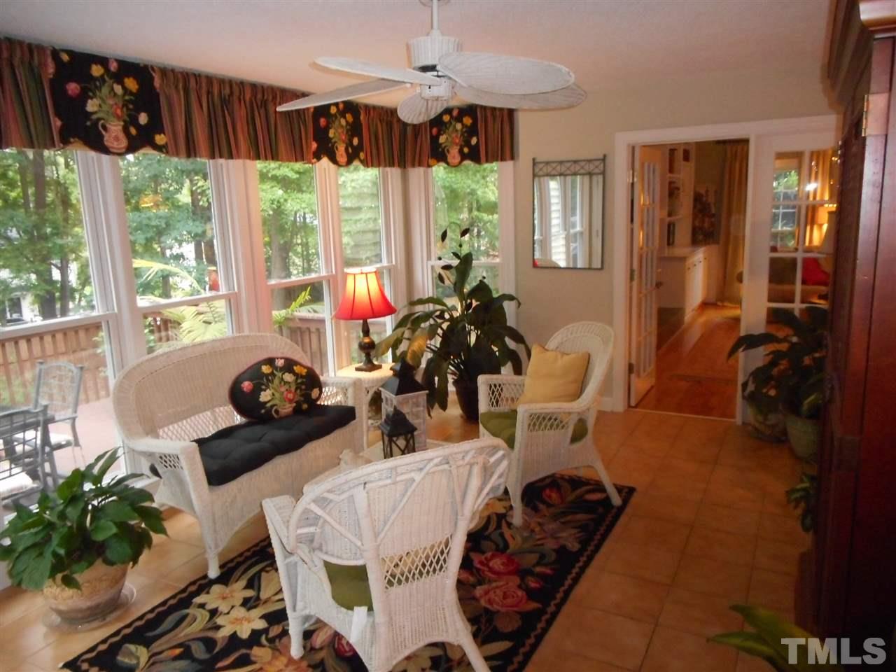7920 Sutterton Court Raleigh, NC 27615 - Photo 8 of 22 a room with furniture and a large window