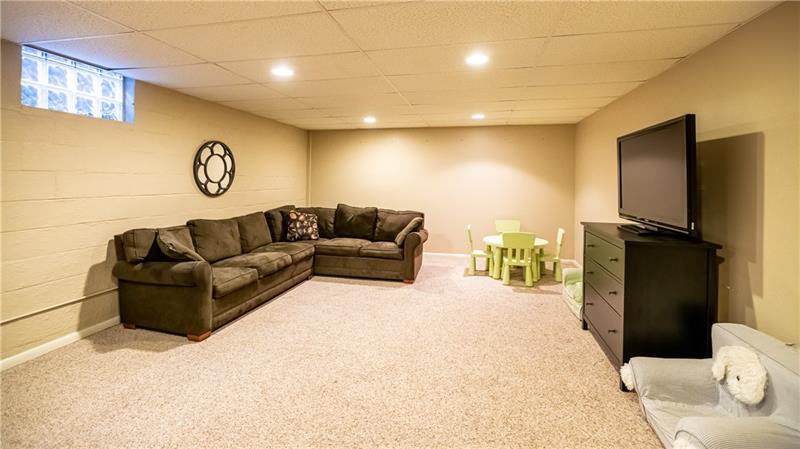 231 Brown Road Wexford, PA 15090 - Photo 22 of 25 Lower level has partially finished gameroom with log fireplace. Also has a workout room; workshop, plenty of storage space; powder room.