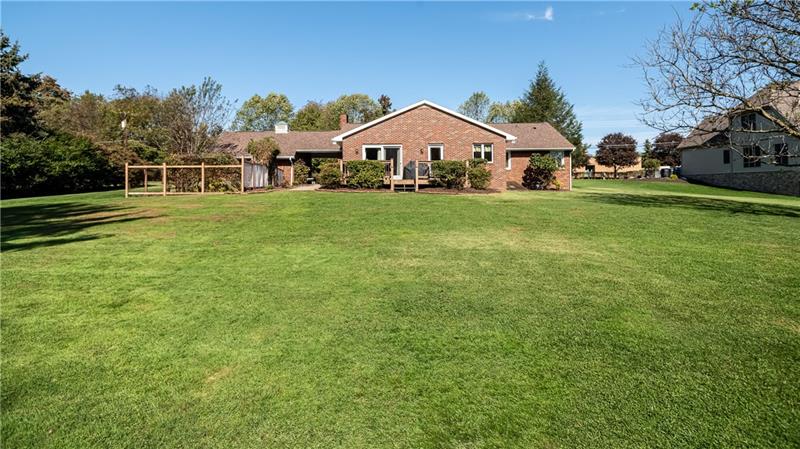 231 Brown Road Wexford, PA 15090 - Photo 24 of 25 Fenced in garden to left and large deck on right. The house backs to North Park Soccer Fields and Walking Trails.