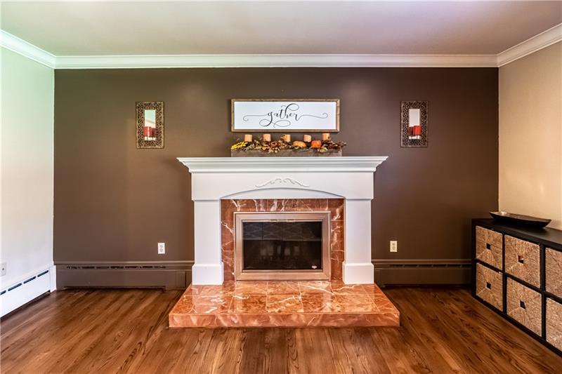231 Brown Road Wexford, PA 15090 - Photo 7 of 25 Marble framed log fireplace.