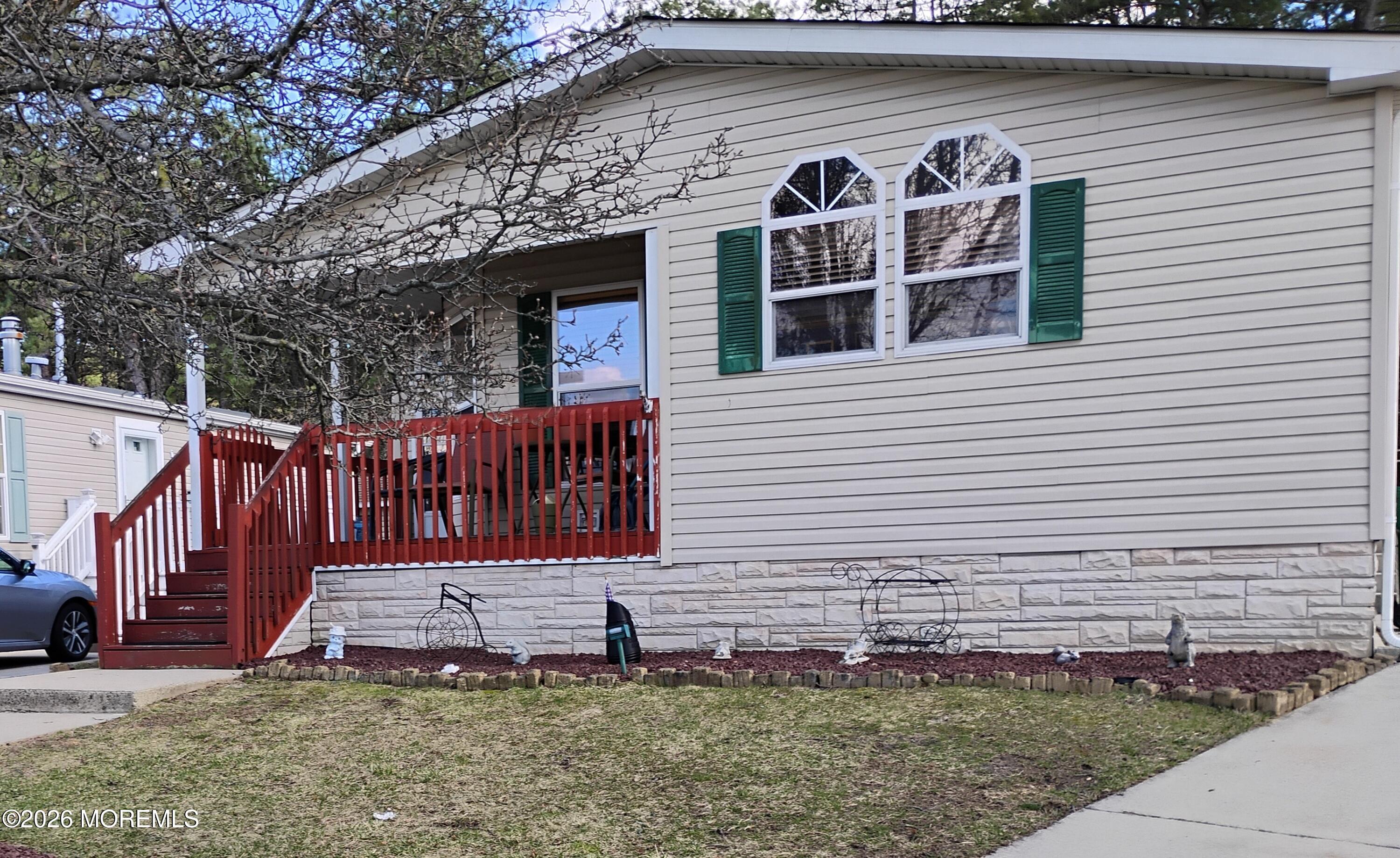1208 Winding Brook Way Whiting, NJ 08759 - Photo 1 of 21 a view of a house with a yard