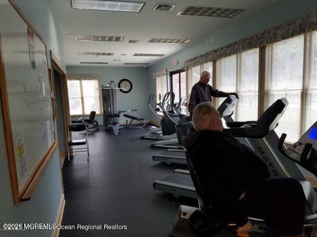 1208 Winding Brook Way Whiting, NJ 08759 - Photo 20 of 21 a view of a room with gym equipment