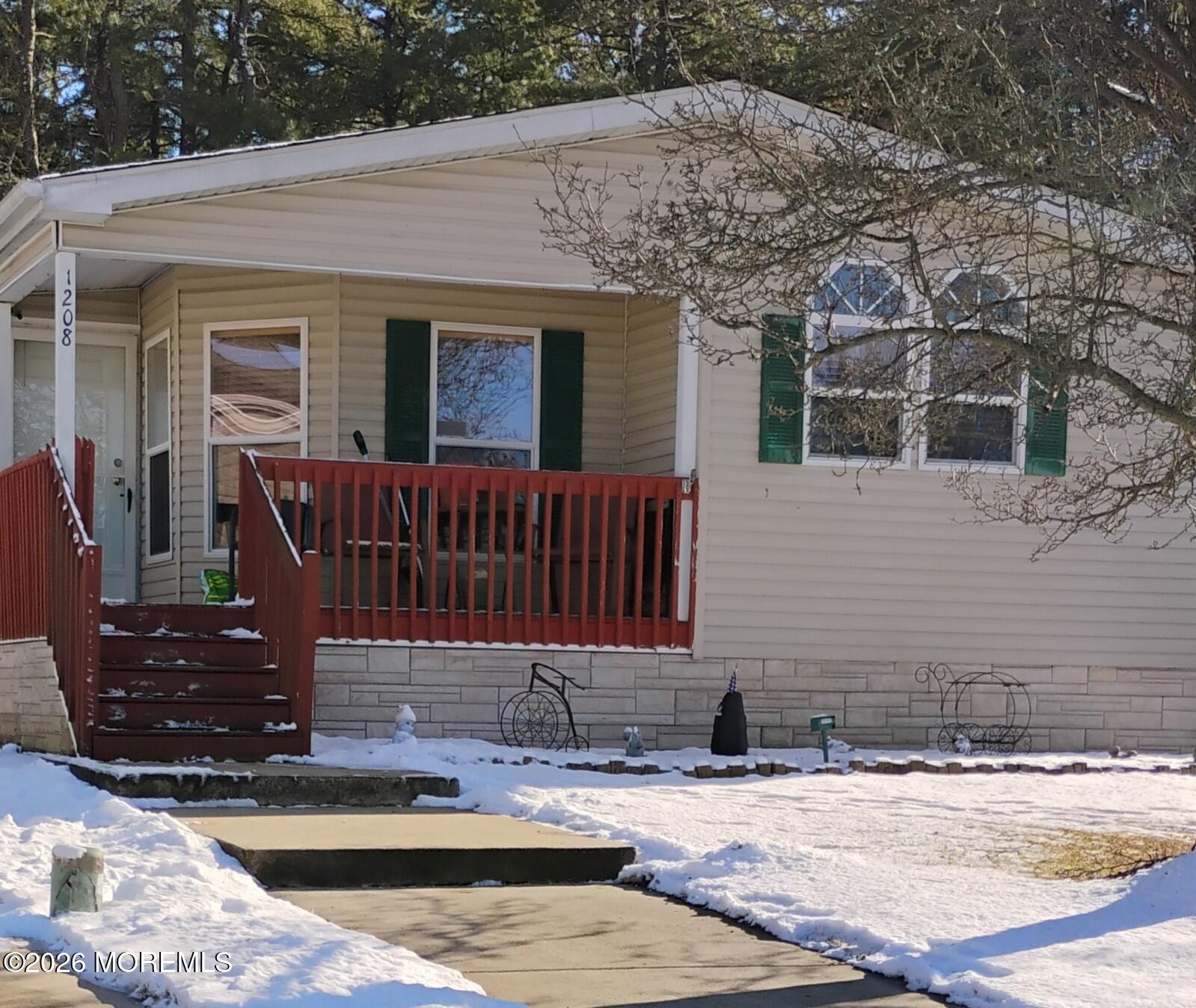 1208 Winding Brook Way Whiting, NJ 08759 - Photo 2 of 21 a view of a house with backyard porch and sitting area