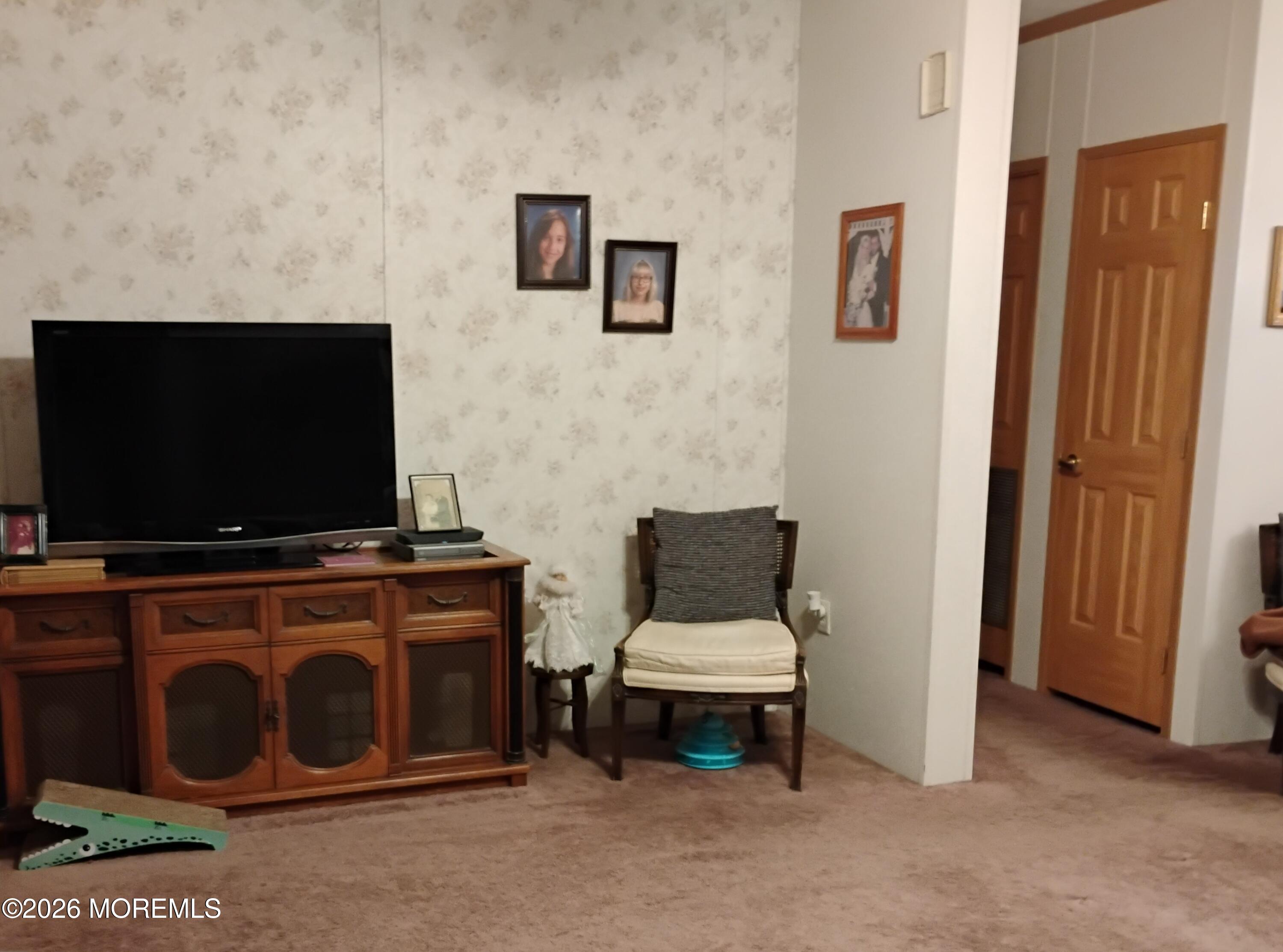 1208 Winding Brook Way Whiting, NJ 08759 - Photo 5 of 21 a living room with furniture and a flat screen tv