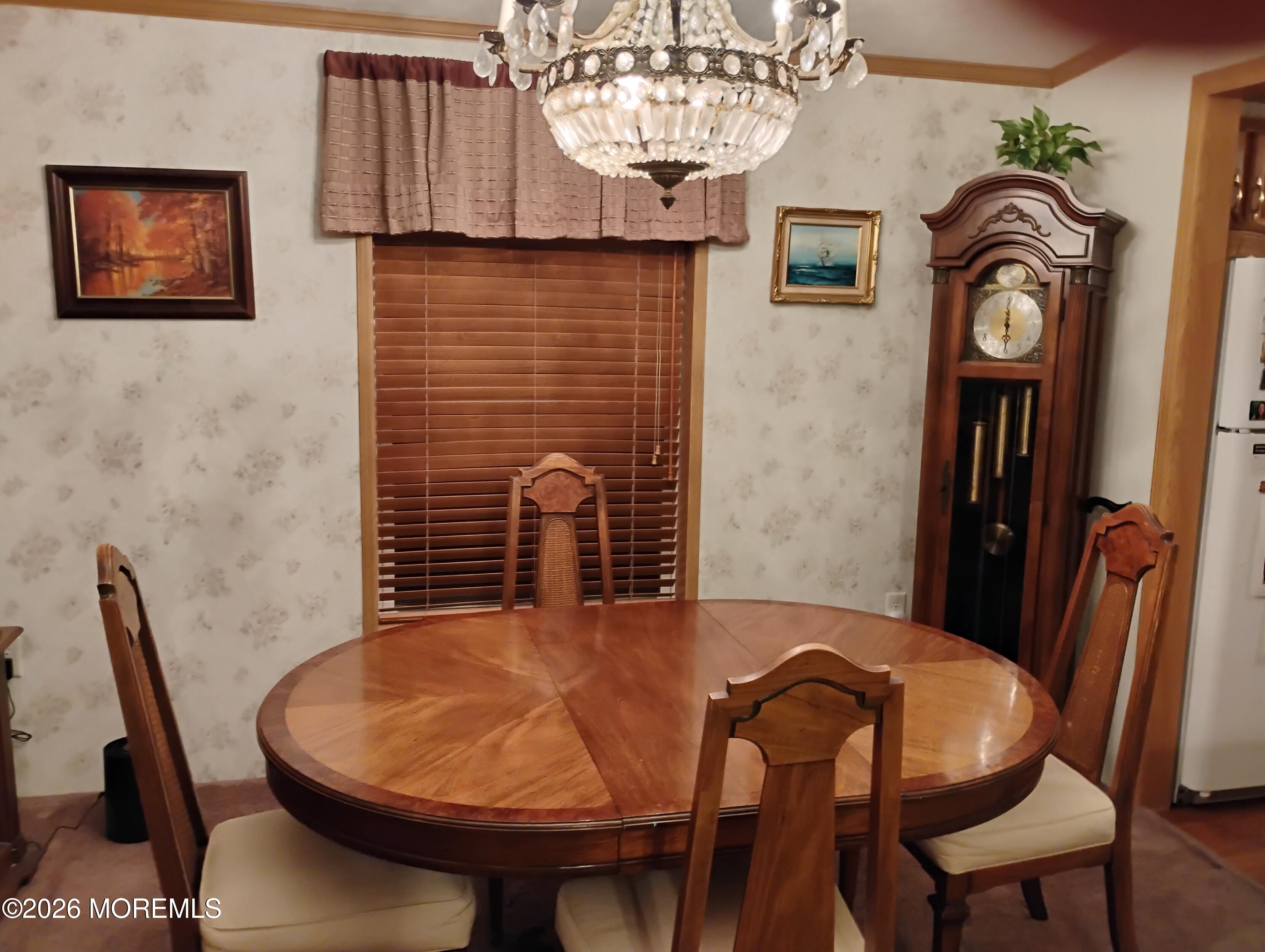 1208 Winding Brook Way Whiting, NJ 08759 - Photo 6 of 21 a view of a dining room with furniture and a chandelier