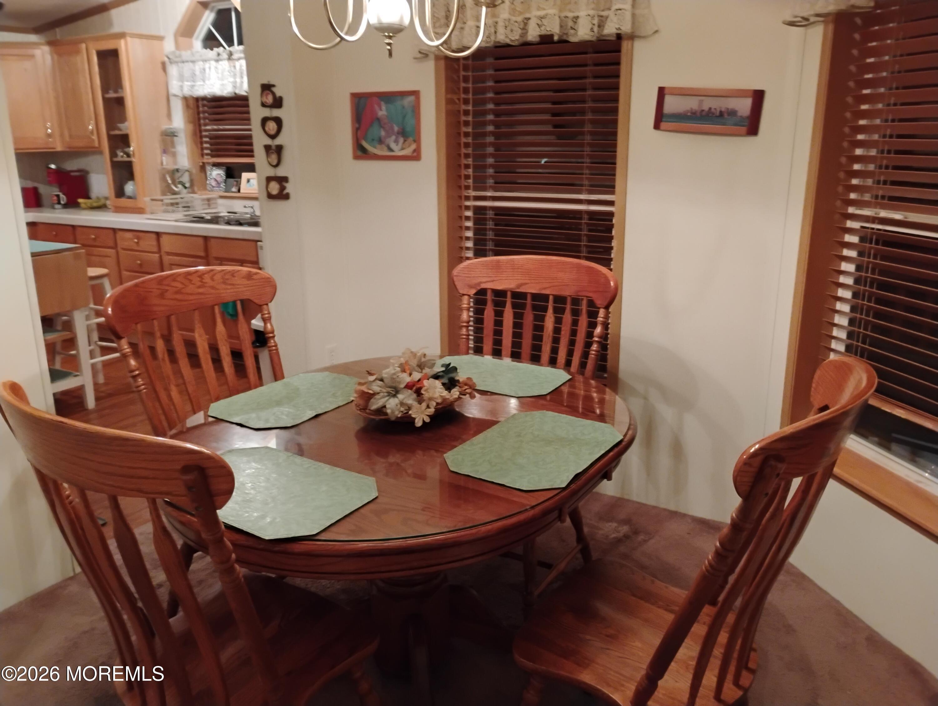 1208 Winding Brook Way Whiting, NJ 08759 - Photo 7 of 21 a view of a dining room with furniture