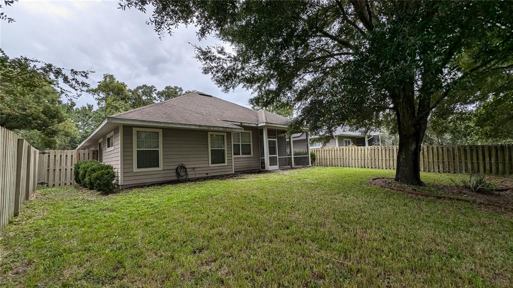 7401 Southwest 86th Way Gainesville, FL 32608 - Photo 12 of 12 a view of a house with a yard and tree s