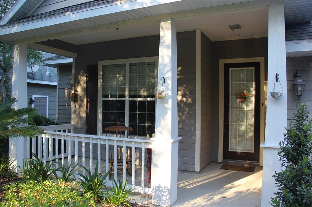 7401 Southwest 86th Way Gainesville, FL 32608 - Photo 2 of 12 front view of a house with a porch