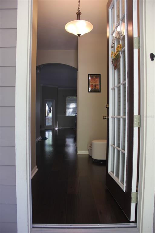 7401 Southwest 86th Way Gainesville, FL 32608 - Photo 3 of 12 a bathroom with a light fixture and a glass door