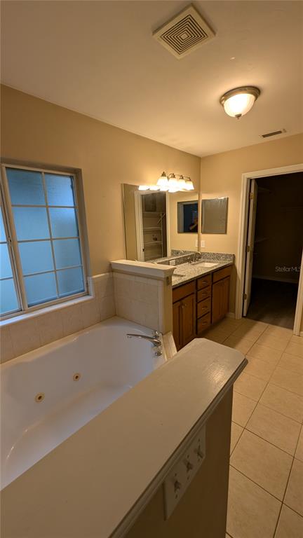7401 Southwest 86th Way Gainesville, FL 32608 - Photo 7 of 12 a kitchen with a sink a microwave and cabinets