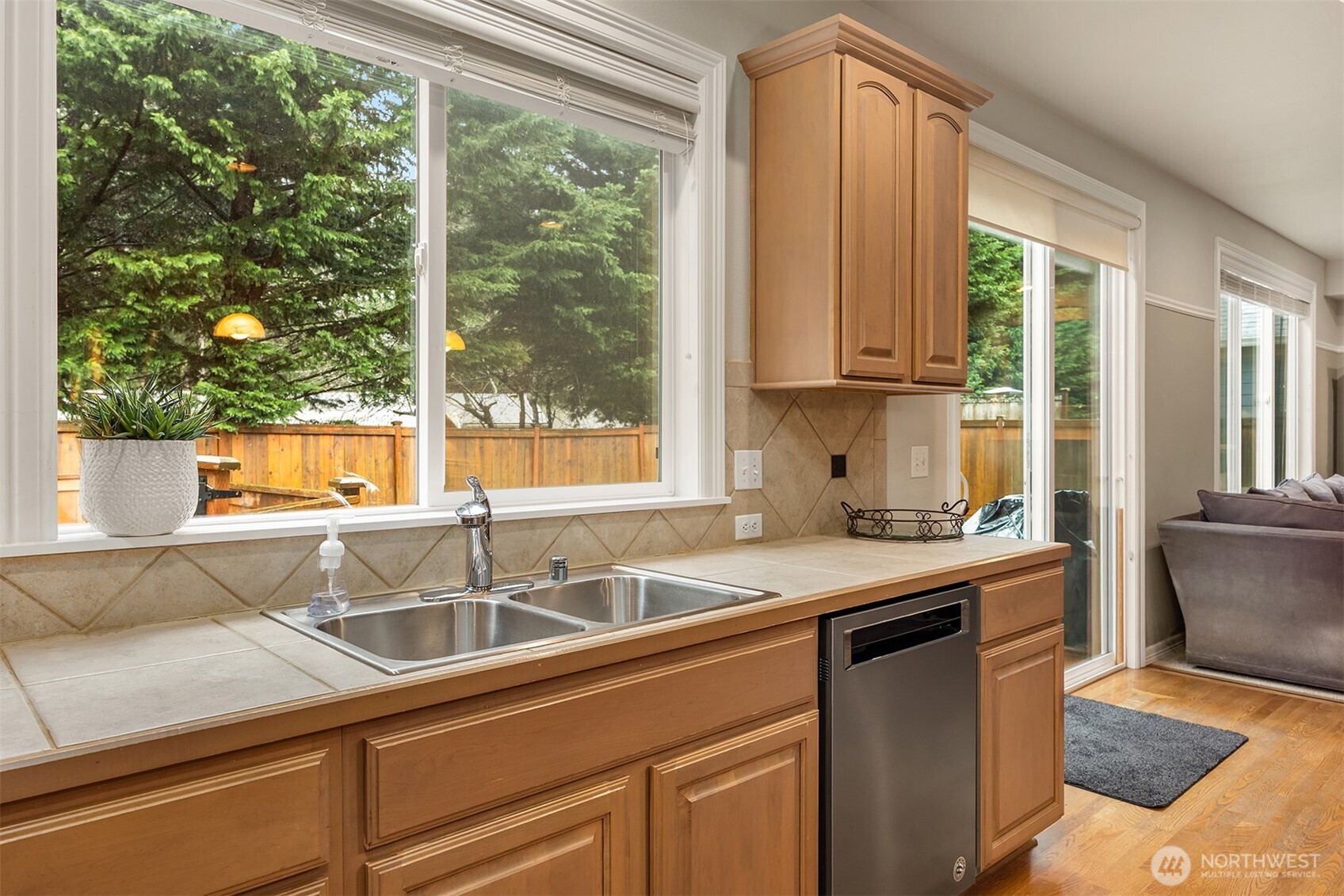 23703 Southeast 284th Street Maple Valley, WA 98038 - Photo 11 of 33 a kitchen with granite countertop a sink and a window