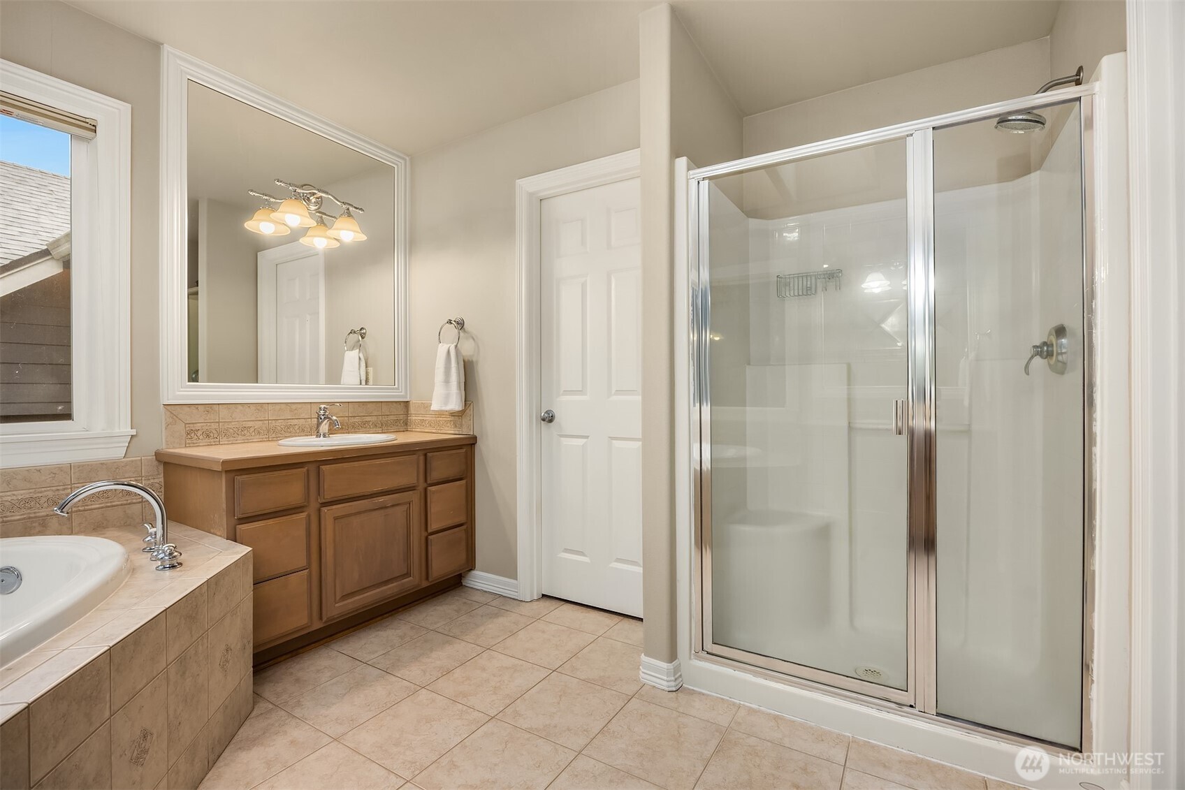 23703 Southeast 284th Street Maple Valley, WA 98038 - Photo 17 of 33 a bathroom with a double vanity sink mirror and shower