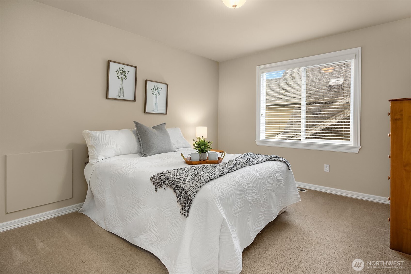 23703 Southeast 284th Street Maple Valley, WA 98038 - Photo 19 of 33 a bedroom with a bed and a window