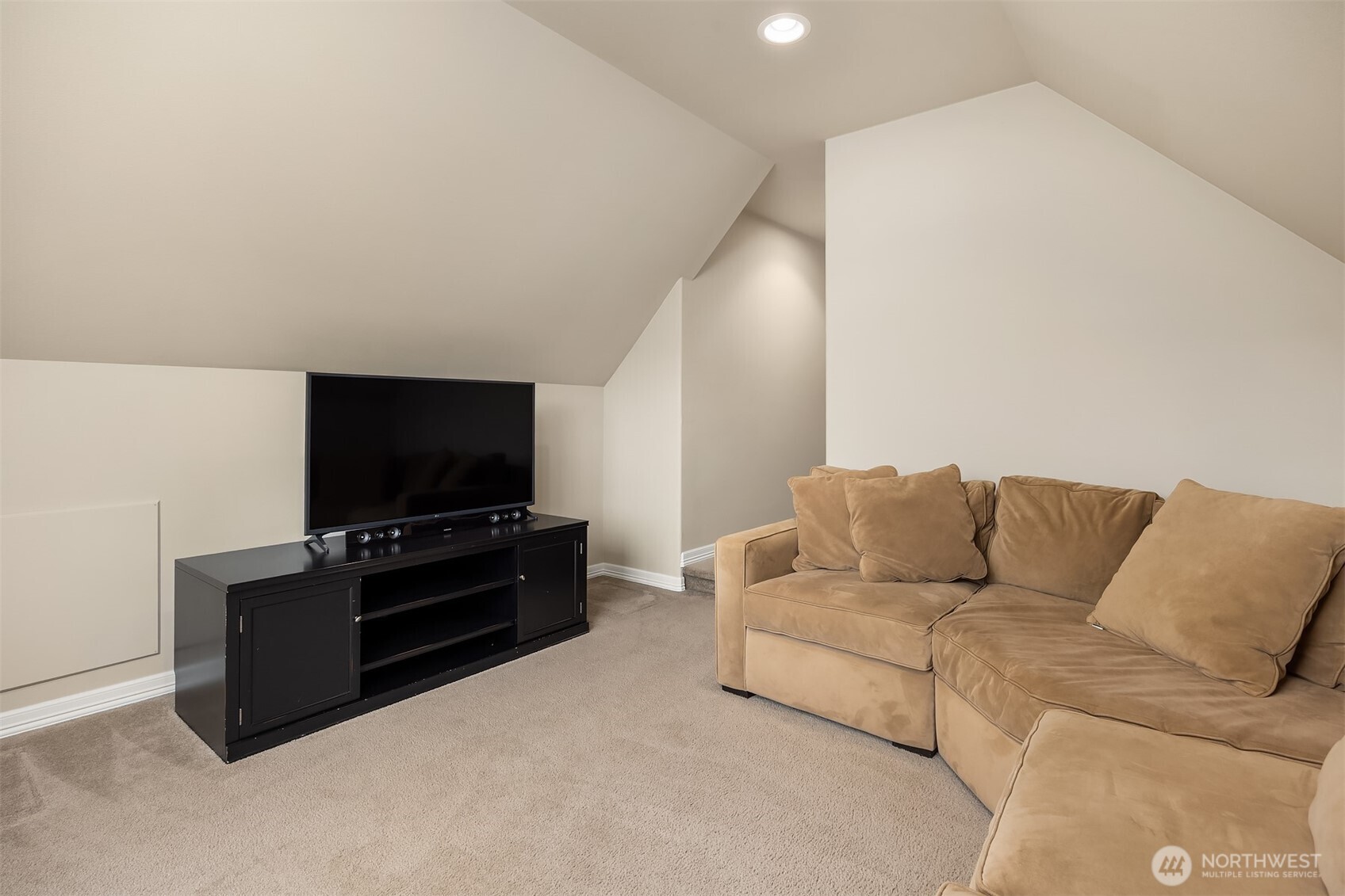 23703 Southeast 284th Street Maple Valley, WA 98038 - Photo 25 of 33 a living room with furniture and a flat screen tv