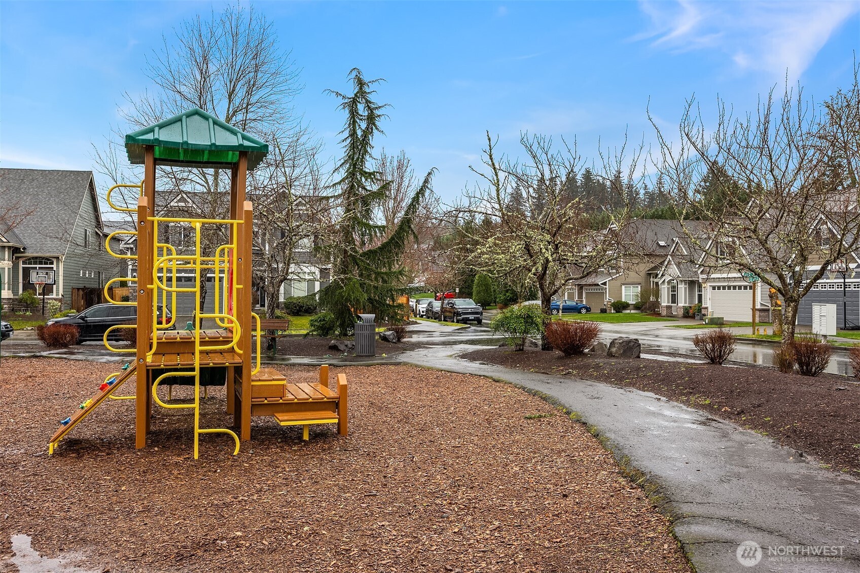 23703 Southeast 284th Street Maple Valley, WA 98038 - Photo 33 of 33 a backyard of a house with barbeque oven table and chairs