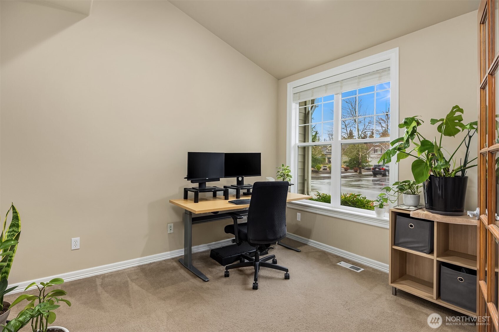 23703 Southeast 284th Street Maple Valley, WA 98038 - Photo 7 of 33 a view of a workspace with furniture and a window