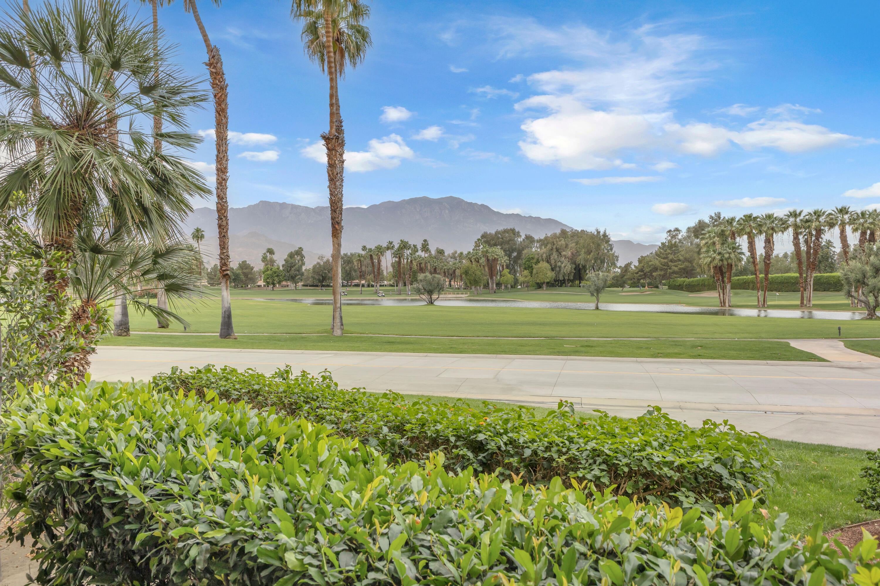 910 Island Drive, Unit 112 Rancho Mirage, CA 92270 - Photo 42 of 47 a view of a golf course with a big yard