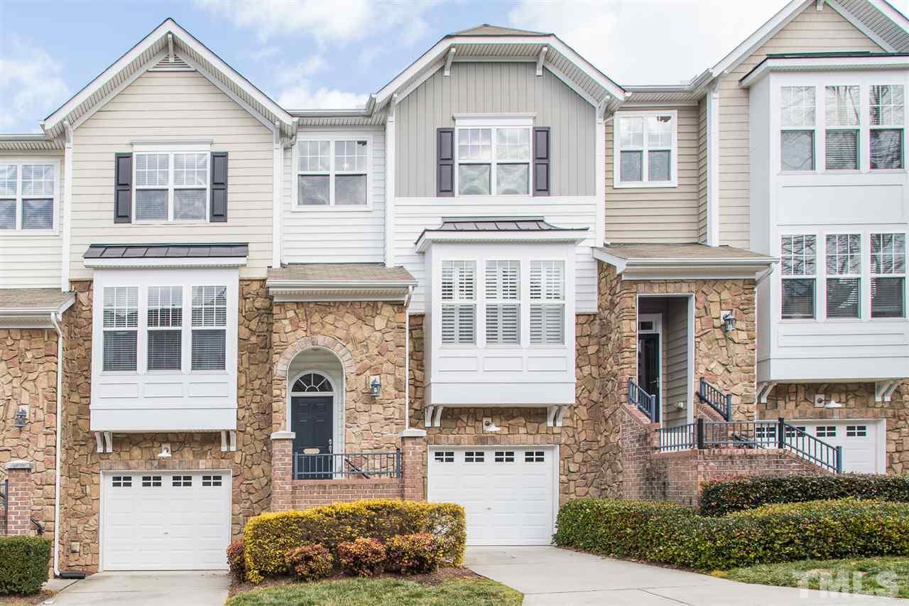 5004 Celtic Court Raleigh, NC 27612 - Photo 1 of 26 a front view of a house with a yard