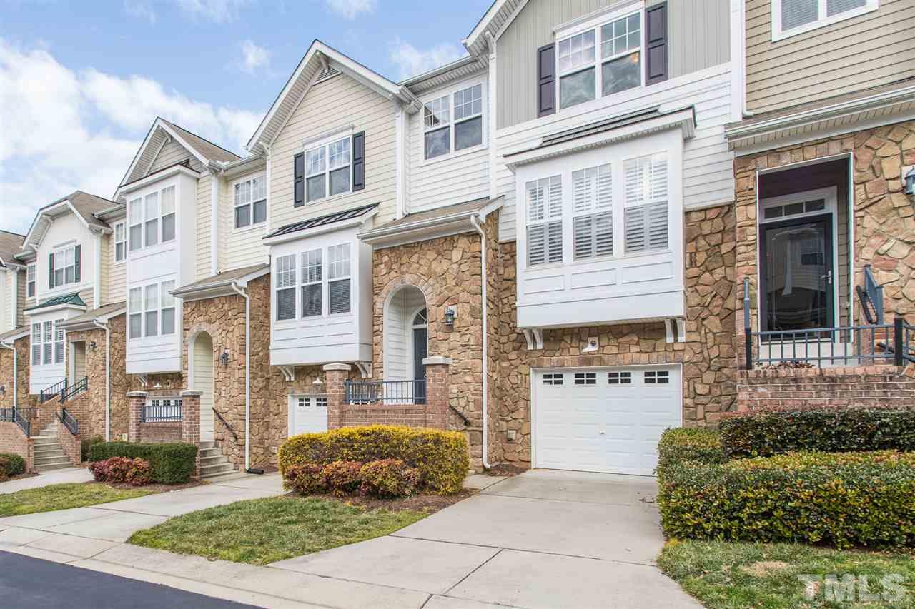 5004 Celtic Court Raleigh, NC 27612 - Photo 2 of 26 a front view of a house with a yard