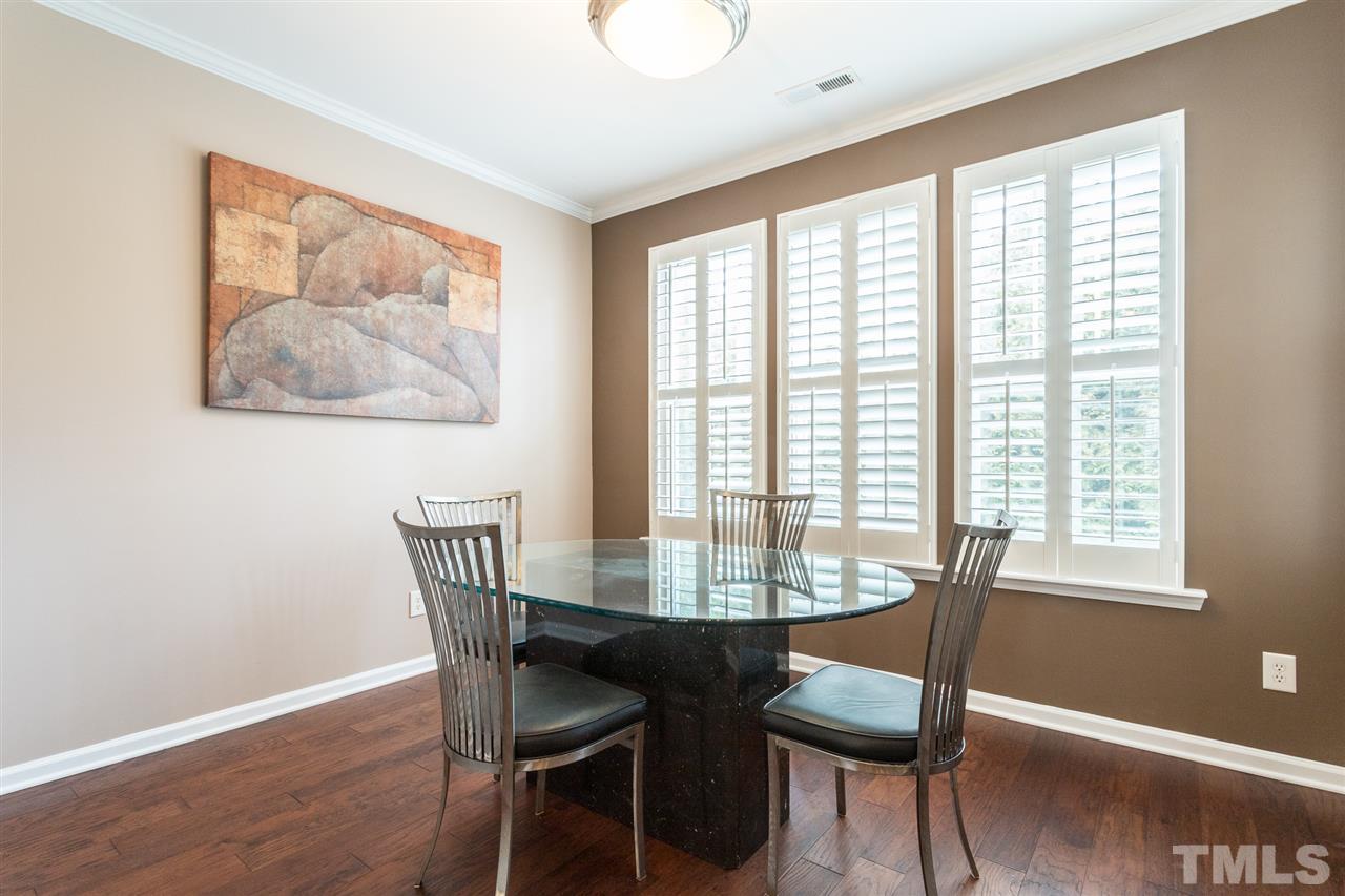 5004 Celtic Court Raleigh, NC 27612 - Photo 12 of 26 a view of a dining room with furniture window and wooden floor