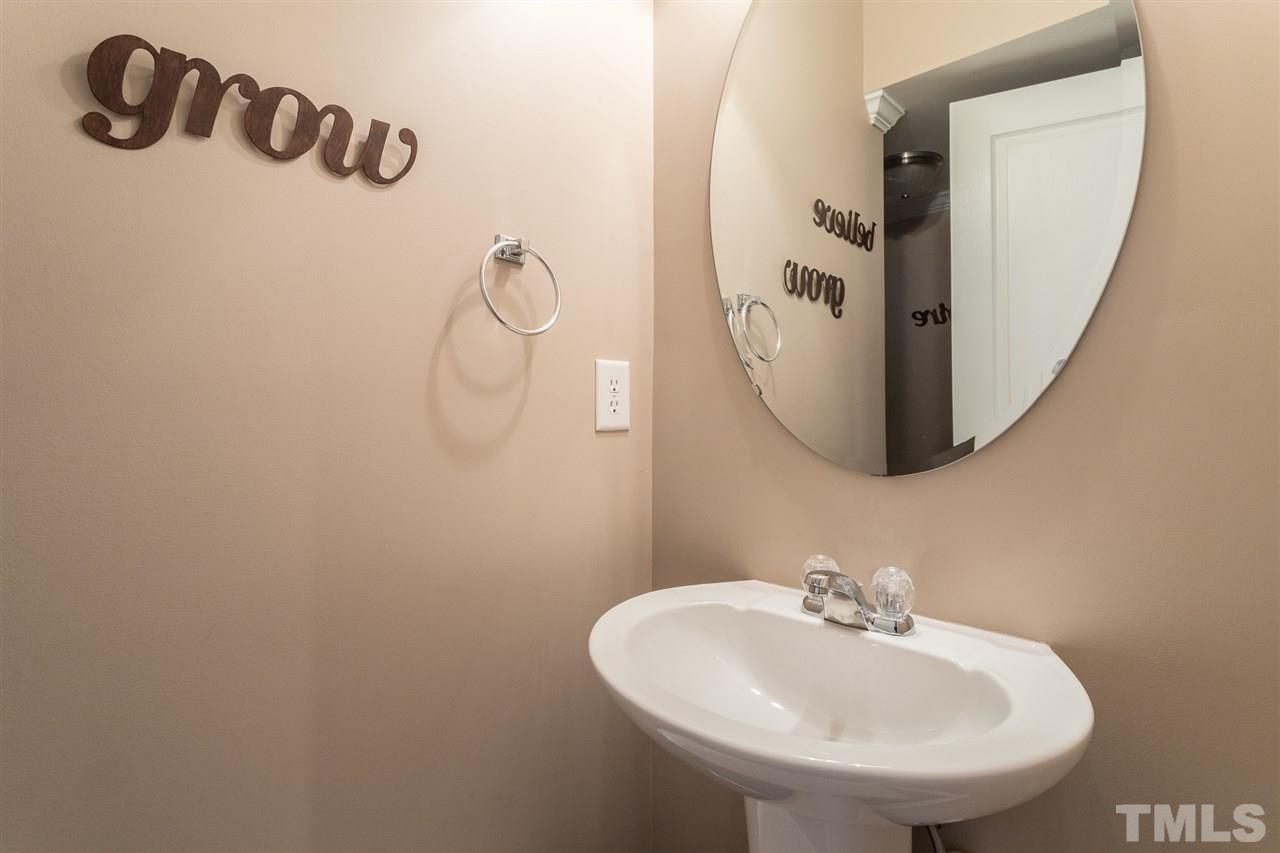 5004 Celtic Court Raleigh, NC 27612 - Photo 15 of 26 a bathroom with a sink and mirror