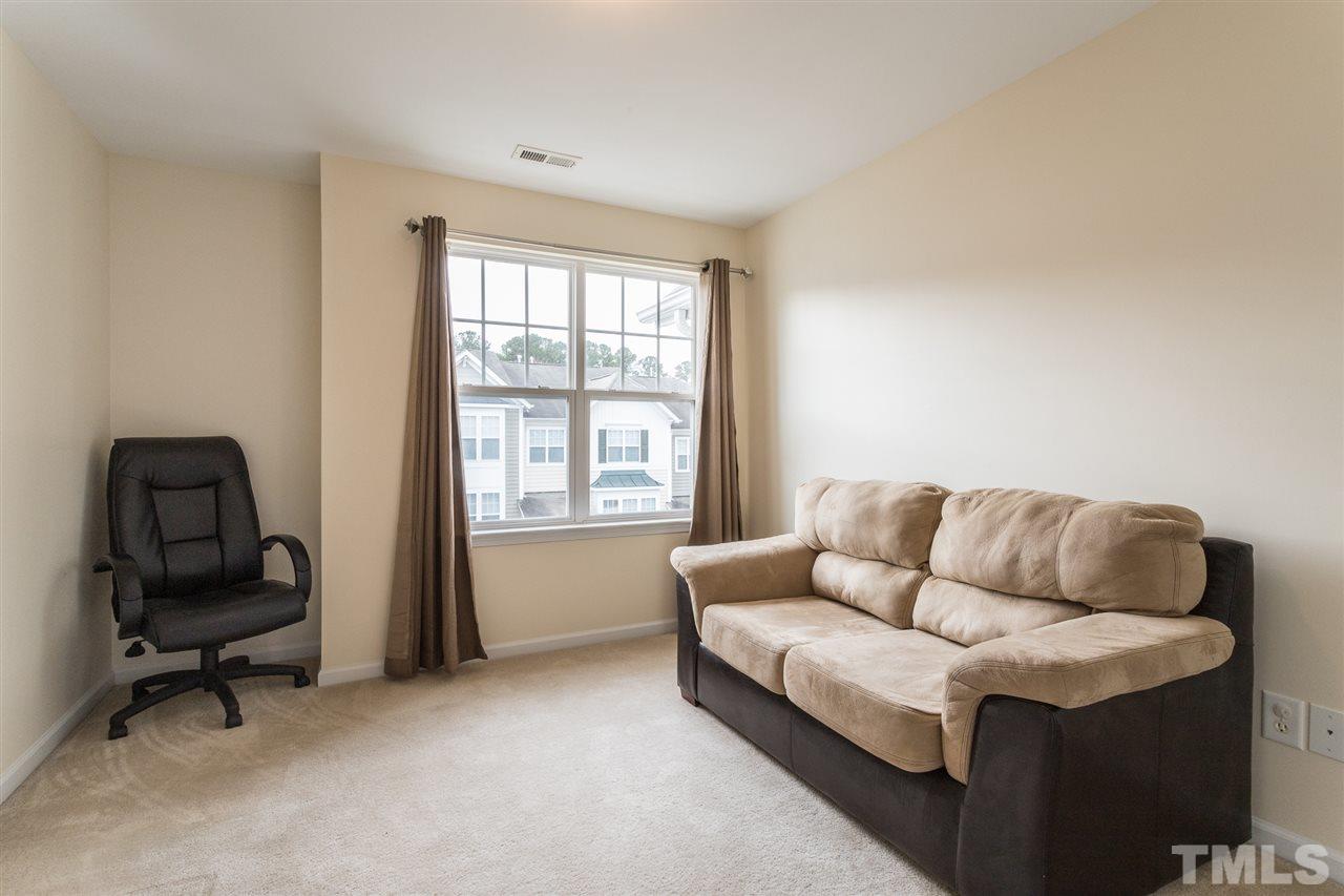 5004 Celtic Court Raleigh, NC 27612 - Photo 18 of 26 a living room with furniture and a window