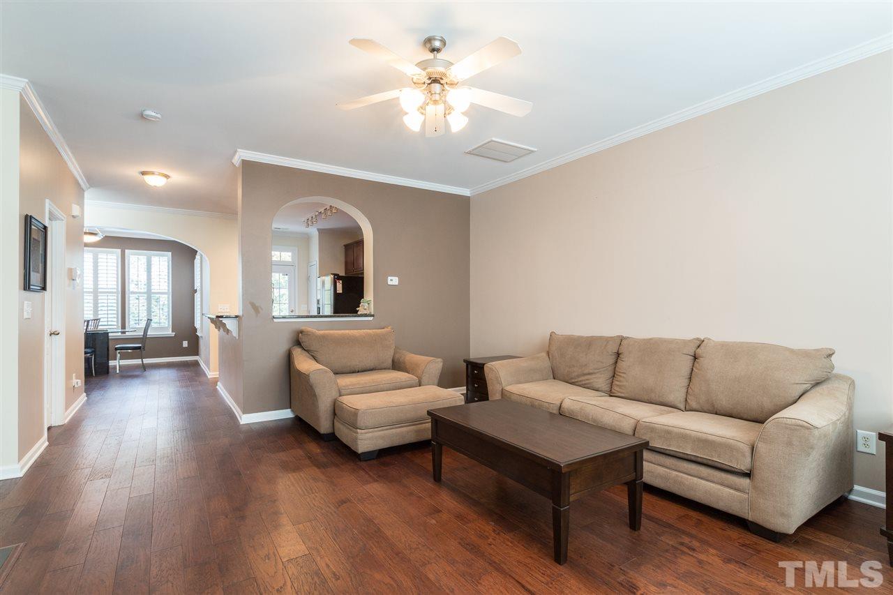 5004 Celtic Court Raleigh, NC 27612 - Photo 3 of 26 a living room with furniture and a chandelier