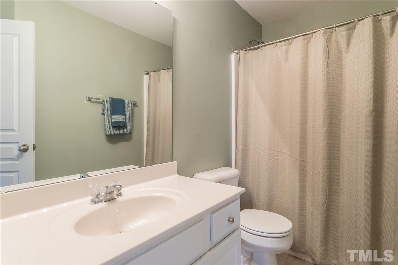 5004 Celtic Court Raleigh, NC 27612 - Photo 21 of 26 a bathroom with a sink toilet and shower