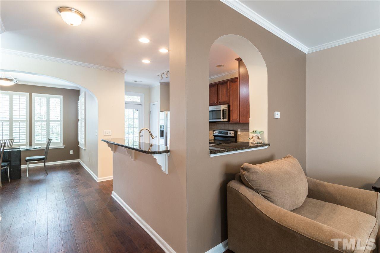5004 Celtic Court Raleigh, NC 27612 - Photo 7 of 26 a living room with furniture and a wooden floor