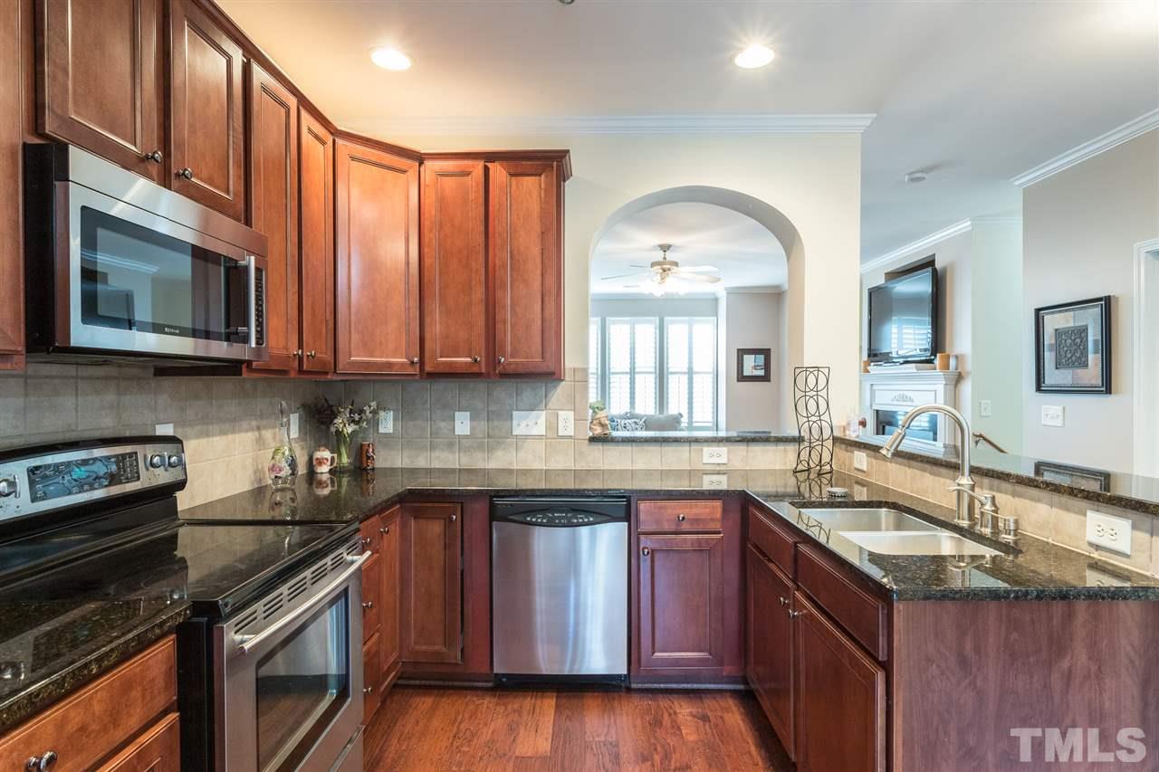 5004 Celtic Court Raleigh, NC 27612 - Photo 9 of 26 a kitchen with a sink stove top oven and microwave