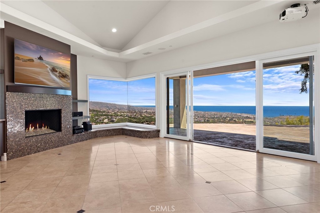14 Mar Del Rey San Clemente, CA 92673 - Photo 12 of 70 a view of an empty room with a fireplace and a large window