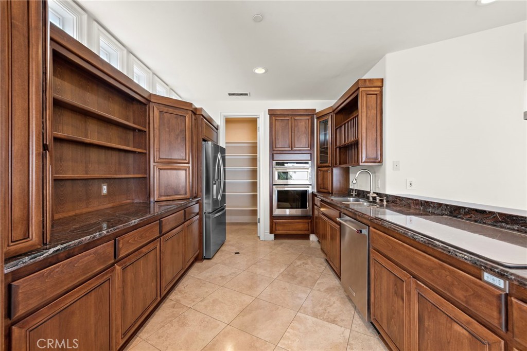 14 Mar Del Rey San Clemente, CA 92673 - Photo 15 of 70 a kitchen with stainless steel appliances a sink and counter top