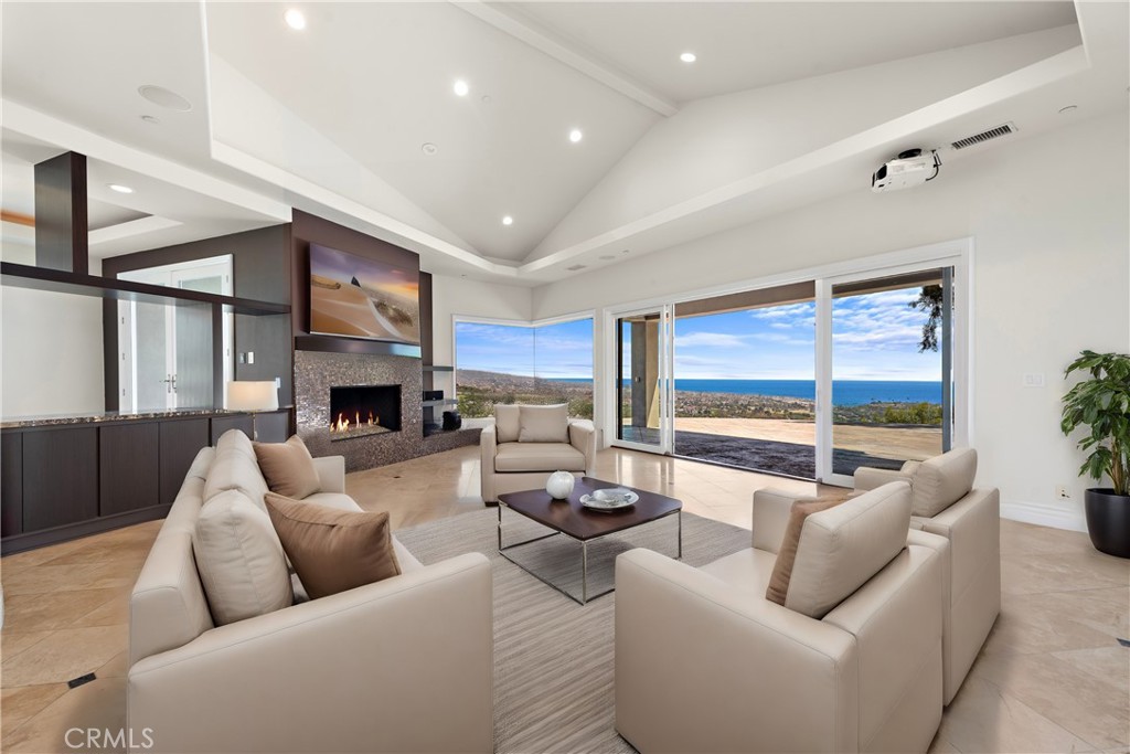 14 Mar Del Rey San Clemente, CA 92673 - Photo 20 of 70 a living room with furniture fireplace and a large window
