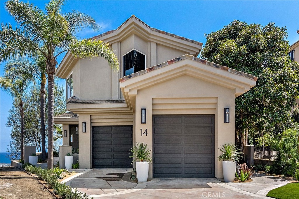 14 Mar Del Rey San Clemente, CA 92673 - Photo 3 of 70 a front view of a house with a garage