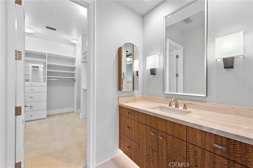 14 Mar Del Rey San Clemente, CA 92673 - Photo 44 of 70 a bathroom with a double vanity sink and mirror