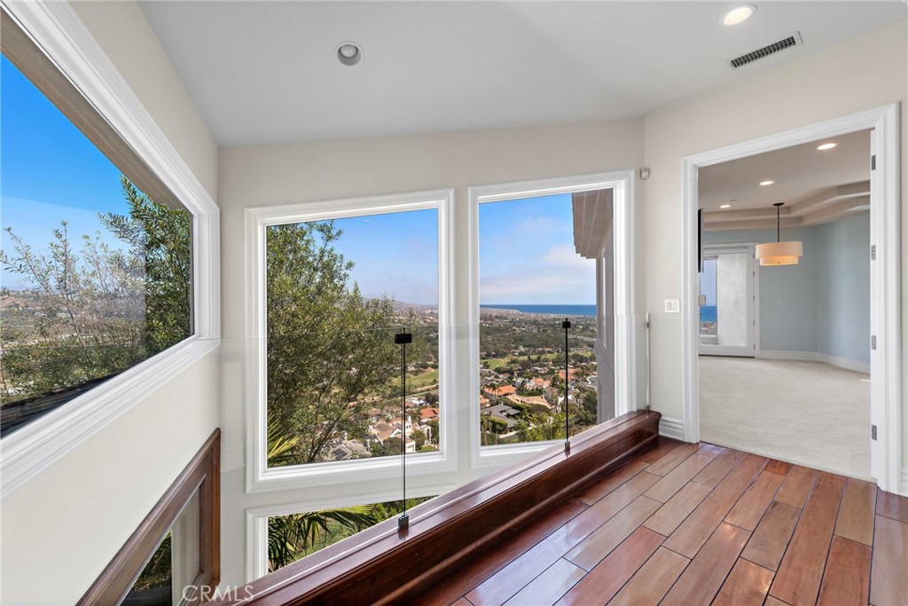 14 Mar Del Rey San Clemente, CA 92673 - Photo 51 of 70 a view of a room with wooden floor and windows